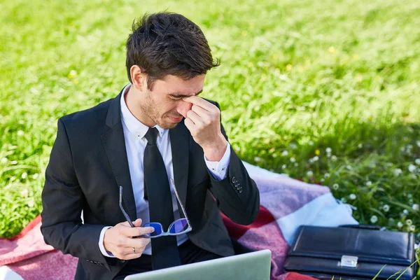 Tired Employee Touching Bridge His Nose While Working Outdoors — Stock Photo, Image