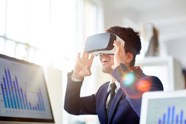 Cheerful Young Businessman Stylish Suit Using Headset While Sitting Desk — Stock Photo, Image