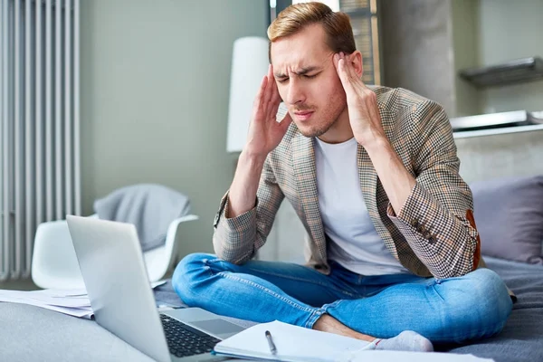 Young Man Touching His Temples While Suffering Headache — Stock Photo, Image