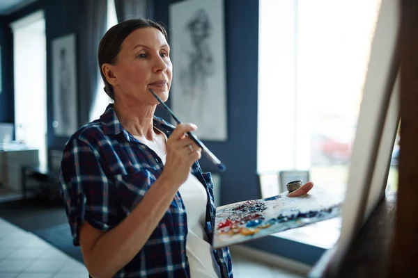 Pensive Female Paintbrush Palette Looking Her Picture Easel — Stock Photo, Image