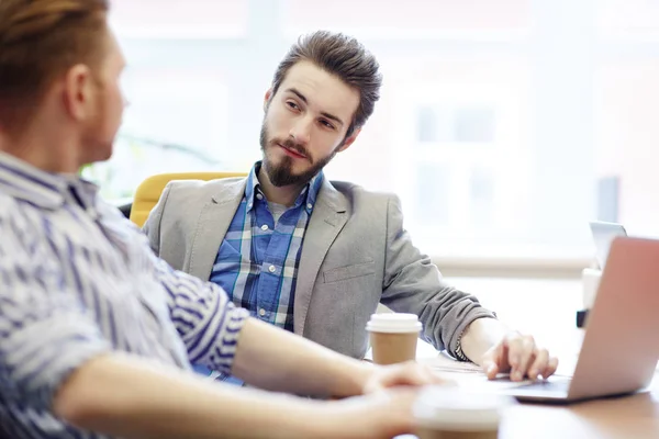 Serious Young Manager Listening His Colleague — Stock Photo, Image