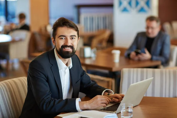 Smiling Middle Aged Financial Manager Bushy Beard Looking Camera While — Stock Photo, Image