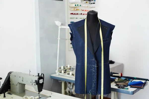 stock image Tailoring studio interior: mannequin and working tables with  sewing machines in empty workshop