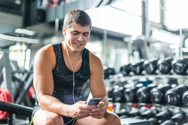 Portrait Strong Muscular Man Listening Music Looking Smartphone Screen While — Stock Photo, Image