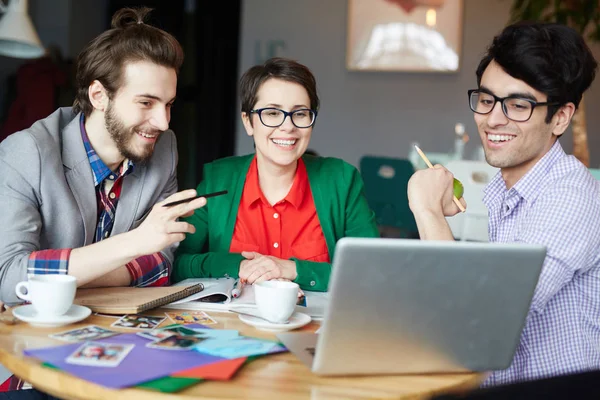 Group Young Creative People Collaborating Meeting Office Smiling Looking Laptop — Stock Photo, Image