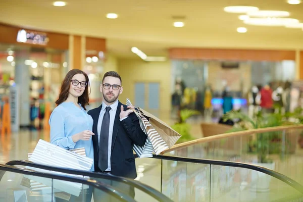 Young Couple Eyeglasses Standing Escalator Mall — Stock Photo, Image