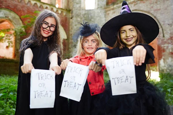 Happy Girls Paper Packets Asking Traditional Halloween Treats — Stock Photo, Image