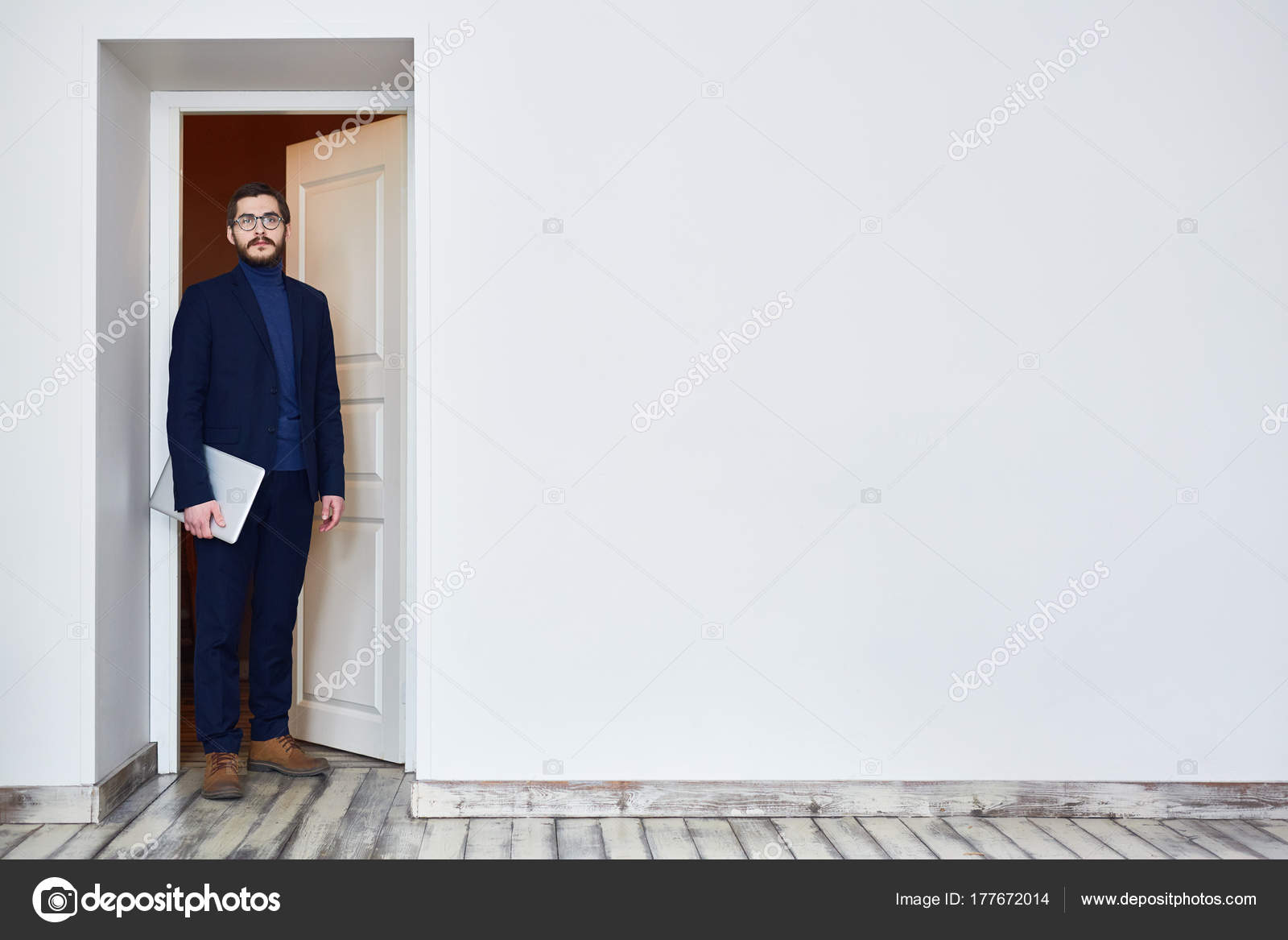 man-glasses-standing-doorway-looking-camera-coming-office-job-interview