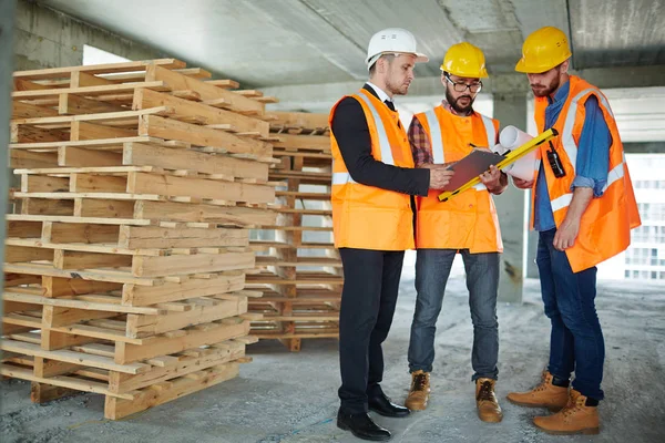 Three Confident Contractors Discussing Plan Working Day — Stock Photo, Image