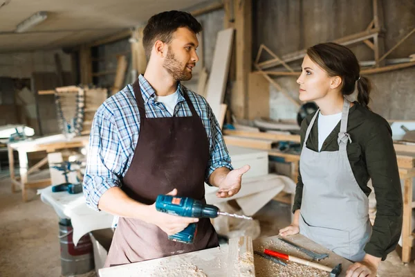 Profile View Pretty Female Apprentice Looking Her Bearded Mentor While — Stock Photo, Image