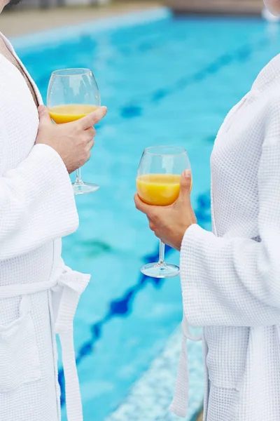Hands Young Couple Bathrobes Holding Fresh Juice Enjoying Spa Vacation — Stock Photo, Image