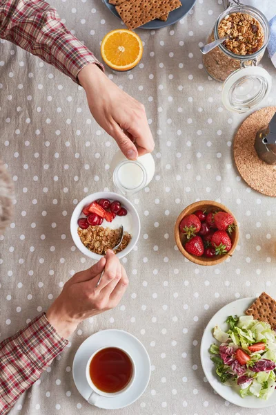 Man Adding Milk Bowl Muesli While Having Breakfast — Stock Photo, Image