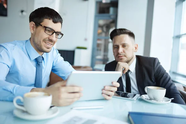 Waist Portrait Young Bearded Employee Holding Digital Tablet Hands Presenting — Stock Photo, Image