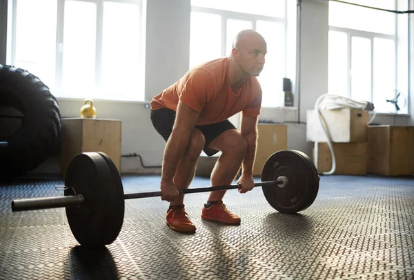 Bald Middle Aged Sportsman Doing Squats Barbell Spacious Gym Full — Stock Photo, Image