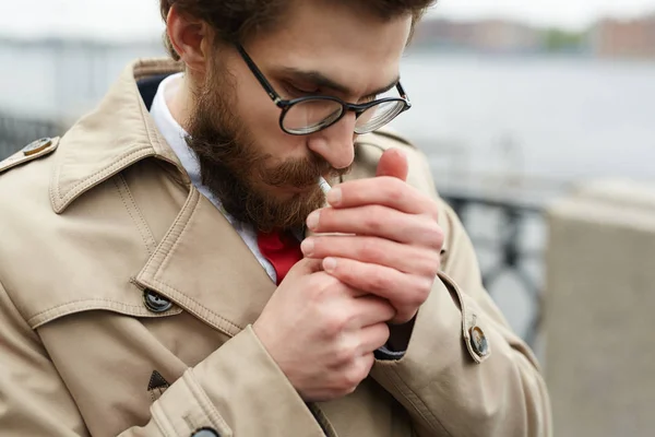 Elegant Young Man Lighting Cigarette Outdoors — Stock Photo, Image