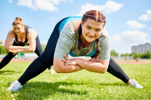 Motivated Obese Woman Her Legs Outstretched Arms Crossed Bending Grass — Stock Photo, Image