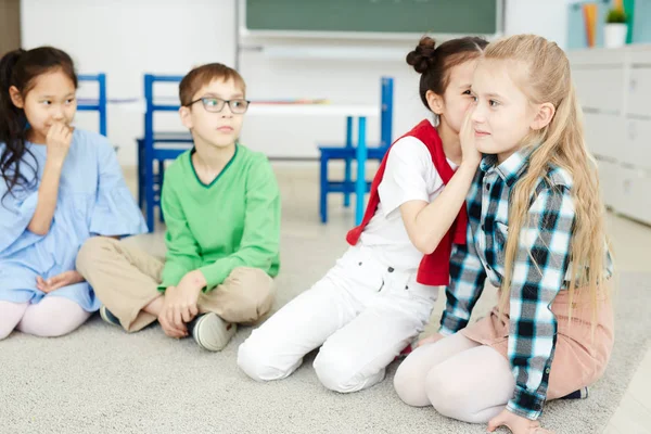 Group Young Classmates Whispering Each Other Curious Phrase Sentence While — Stock Photo, Image