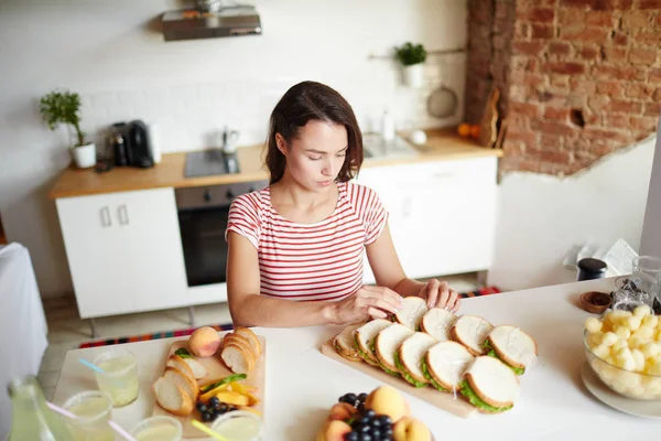 Attractive Young Woman Putting Homemade Sandwiches Two Rows Wooden Board — Stock Photo, Image