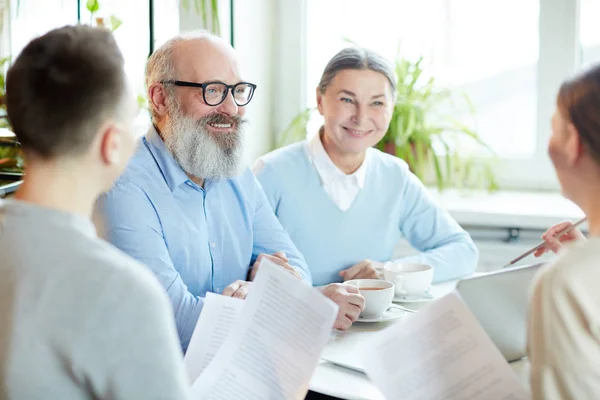 Young Senior Colleagues Sitting Table Cafe Having Discussion Papers Ideas — Stock Photo, Image