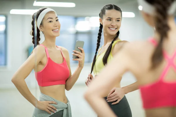 Two Happy Fit Girls Making Selfie Gym While Looking Mirror — Stock Photo, Image