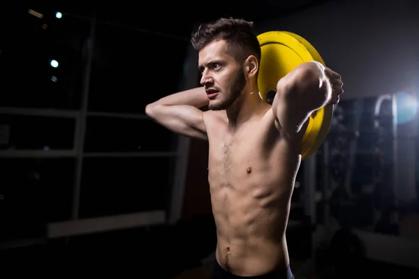 Sporty Muscular Man Holding Heavy Barbell Disc Head While Exercising — Stock Photo, Image