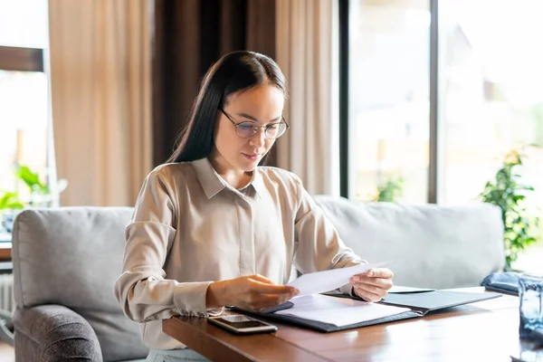 Serious Young Brunette Businesswoman Sitting Table Restaurant While Looking Papers — Stock Photo, Image