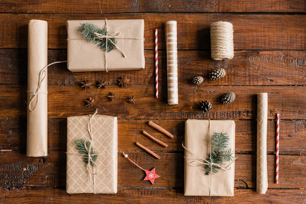 Top View Packed Wrapped Giftboxes Rolled Paper Pinecones Decorations Threads — Stock Photo, Image