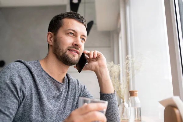 Happy Young Bearded Man Pullover Communicating Someone Mobile Phone While — Stock Photo, Image