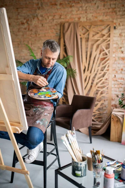 Contemporary Painter Casualwear Apron Mixing Colors Palette While Sitting Front — Stock Photo, Image