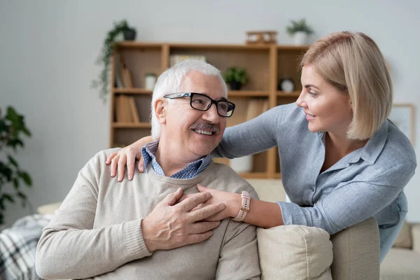 Restful Senior Man Couch Looking His Young Blonde Daughter Standing — Stockfoto
