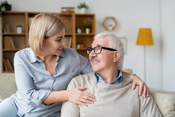 Restful Senior Man His Young Daughter Relaxing Couch Smiling Looking — Stockfoto