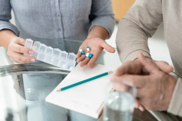 Hands Young Woman Holding Pills While Showing Medicine Her Sick — Stok fotoğraf