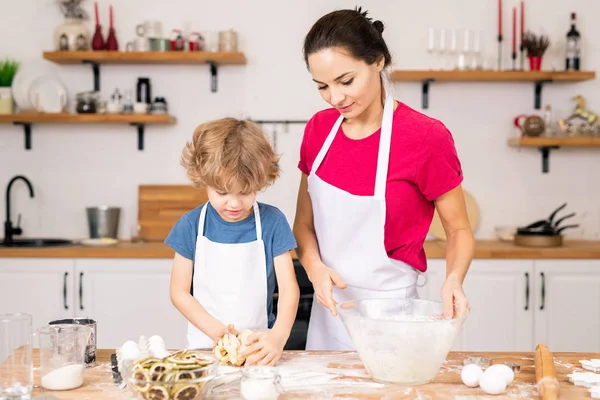 Adorable Boy Kneading Selfmade Dough Cookies While Helping His Mom — Stock Photo, Image