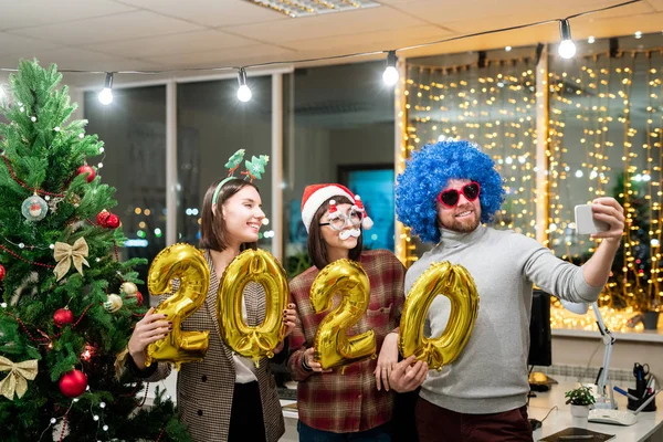 Three Cheerful Young Office Managers Holding Inflatable Numbers While Making — Stock Photo, Image