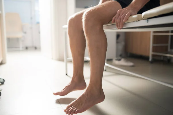 Bare Legs Sick Male Patient Sitting Couch Medical Office While — 스톡 사진