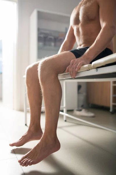 Bare Legs Relaxed Shirtless Male Patient Sitting Couch Medical Office — 图库照片