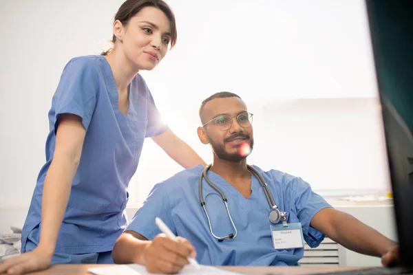 Young Successful Clinicians Uniform Looking Computer Screen While Working New — Stok fotoğraf