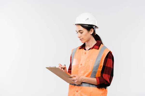 Joven Constructora Hardhat Franela Chaleco Trabajo Haciendo Notas Documento Delante —  Fotos de Stock