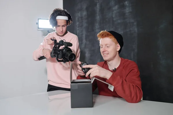 Young Cameraman Shooting Happy Male Vlogger Holding New Photocamera Open — 스톡 사진