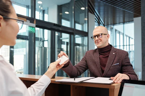 Bald Mature Businessman Eyeglasses Formalwear Taking Card Hand Receptionist Filling — Stockfoto