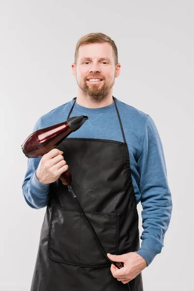 Happy Young Hairdresser Apron Blue Pullover Holding Hairdryer While Working — ストック写真