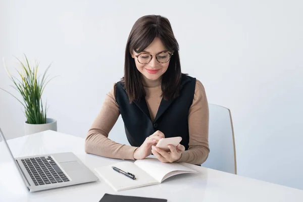 Young Teacher Businesswoman Smartphone Open Copybook Looking Contact While Sitting — 스톡 사진