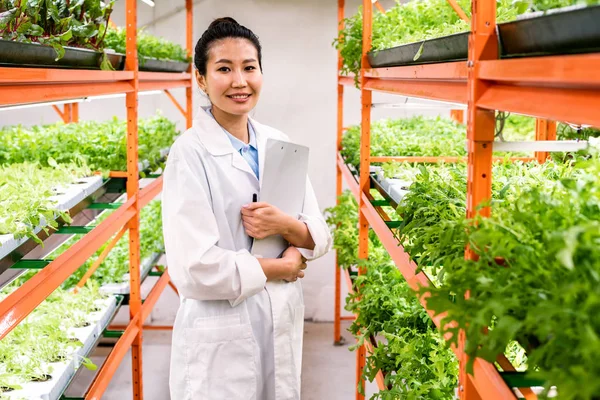 Young Successful Female Researcher Agronomist Whitecoat Standing Aisle Shelves Green — 스톡 사진