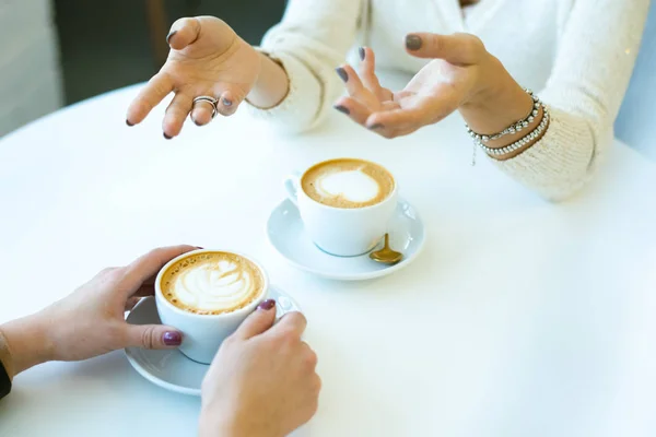 Hands Young Female Talking Her Friend Front While Both Sitting — Stock Photo, Image