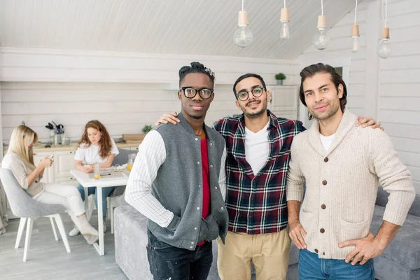 Three Young Male Friends Posing Camera While Girls Sitting Table — Stock Photo, Image