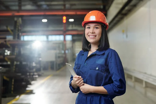 Pretty Young Smiling Engineer Uniform Protective Helmet Holding Tablet While — Stock Photo, Image