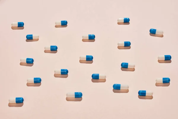 White Blue Capsules Neutral Pale Pink Background Horizontal Flat Lay — ストック写真
