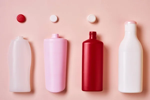 Horizontal Flat Lay Conceptual Image Plastic Bottles Tops Pale Pink — Stockfoto