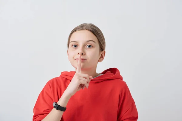 Portrait Teenage Girl Red Hoodie Holding Finger Lips While Making — Stock Photo, Image
