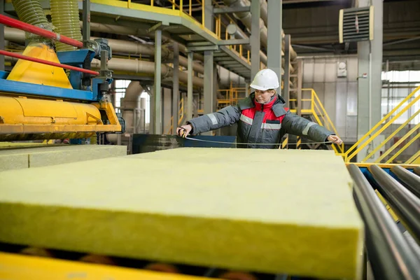 Production Line Worker Hardhat Standing Conveyor Belt Measuring Construction Material — ストック写真